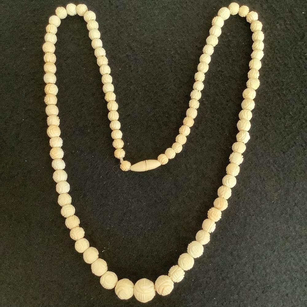 Vintage hand carved bone necklace.